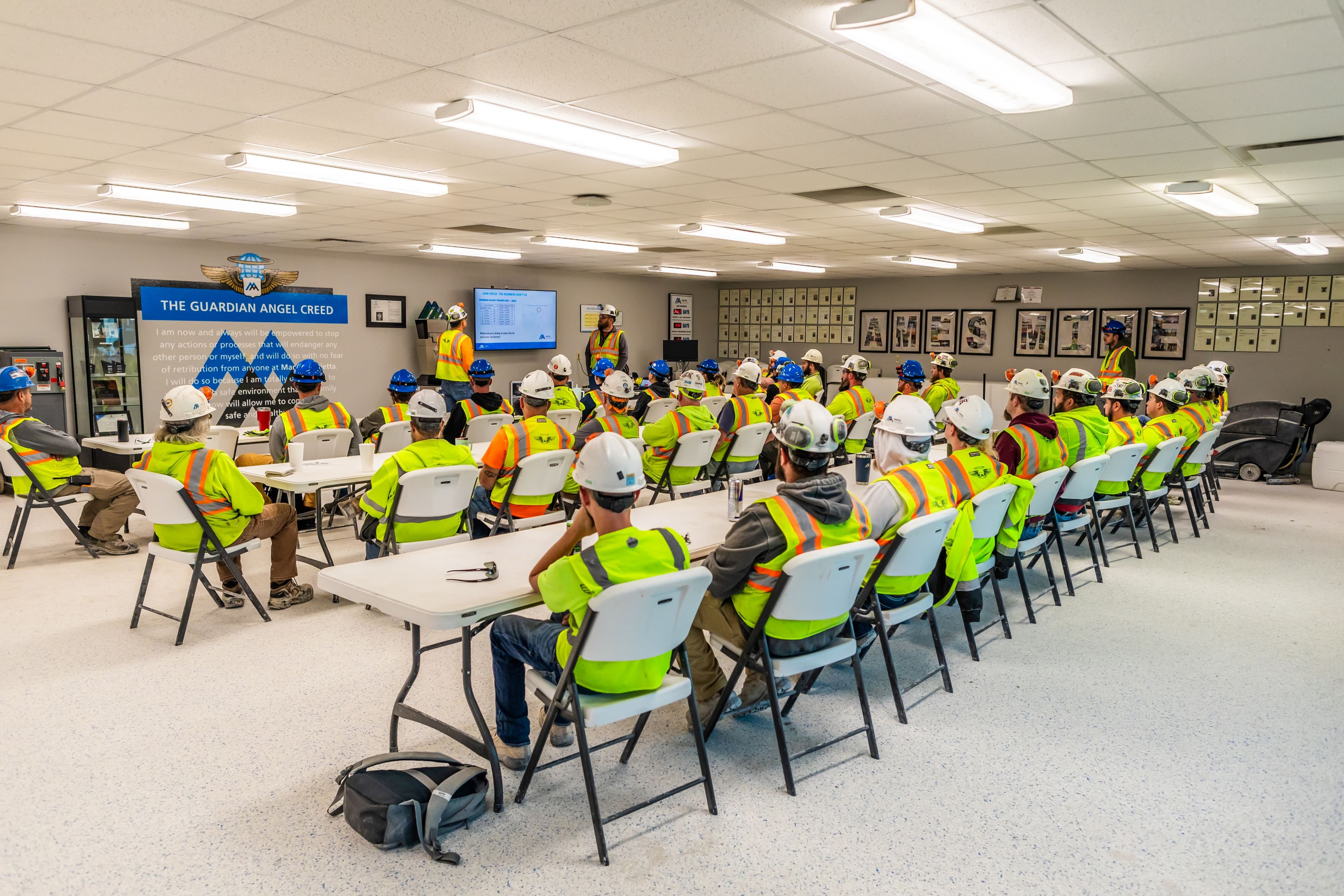 The Ames Mine crew listens attentively during a safety meeting.
