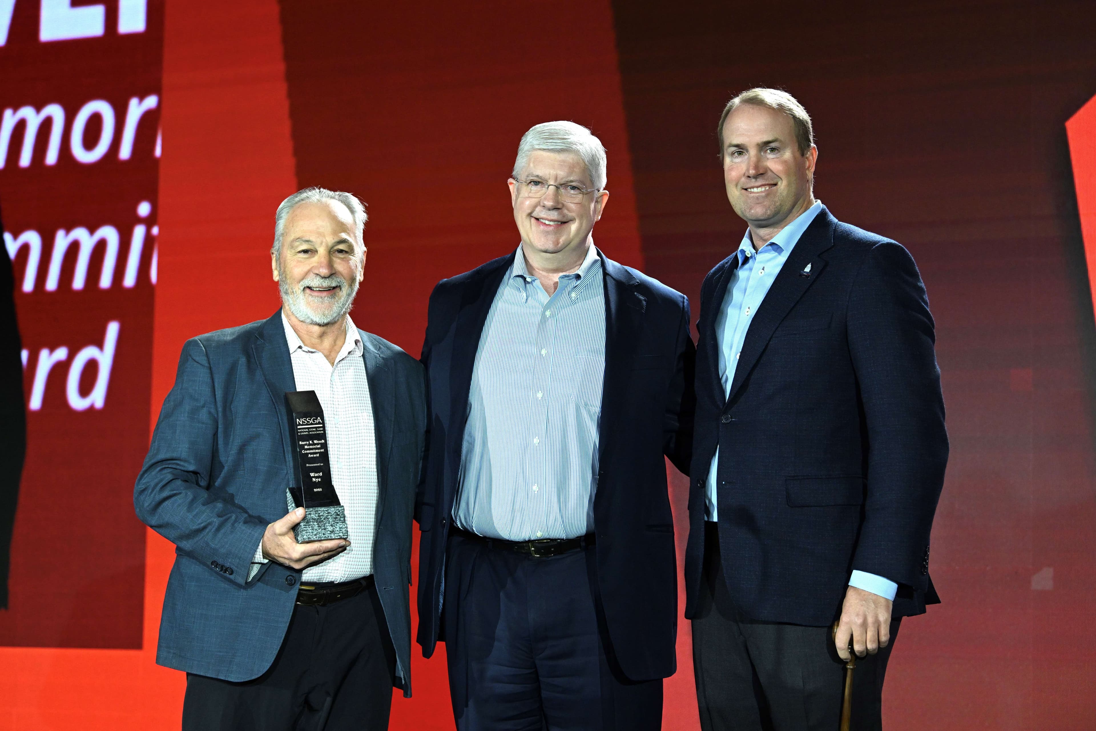 Martin Marietta Chair and CEO Ward Nye (center) receives the 2025 Barry K. Wendt Memorial Commitment Award.