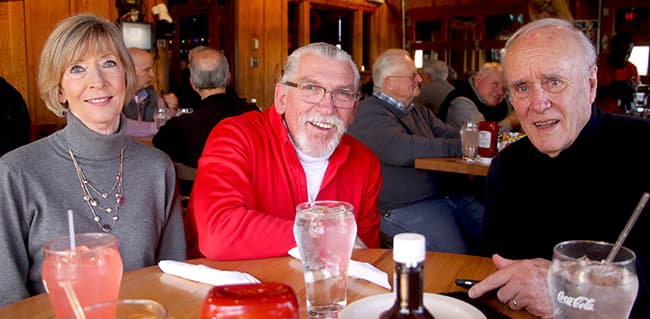 Carlton Brady, former director of HR and Safety for the Mid-Atlantic and Southeast divisions (center) sits with former Greensboro District Sales Manager Don Douglas and his wife, Marie, also a former employee.