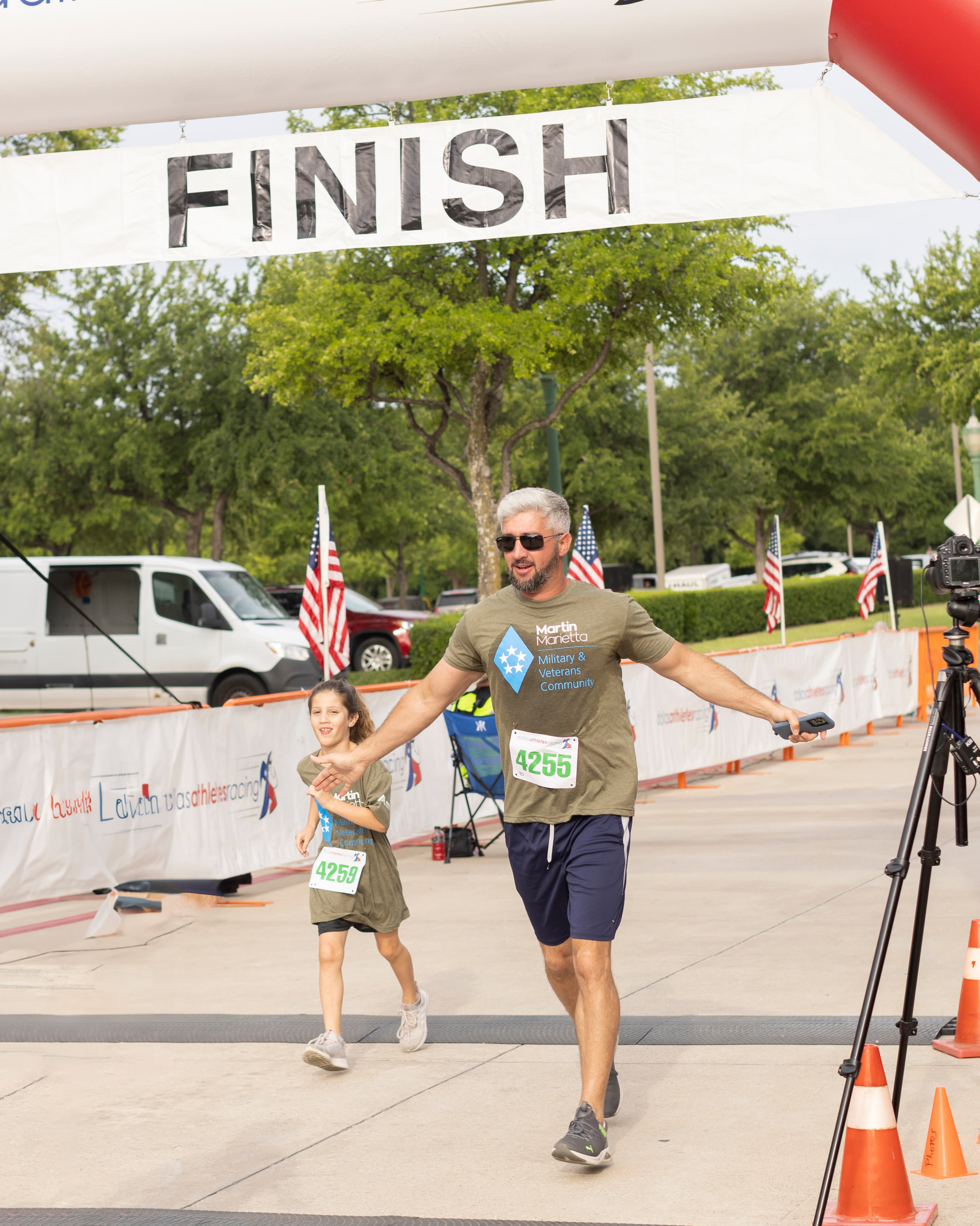 Kevin Stone, director of government affairs in the Central Texas District, crosses the finish line of the Memorial Day 5K run.