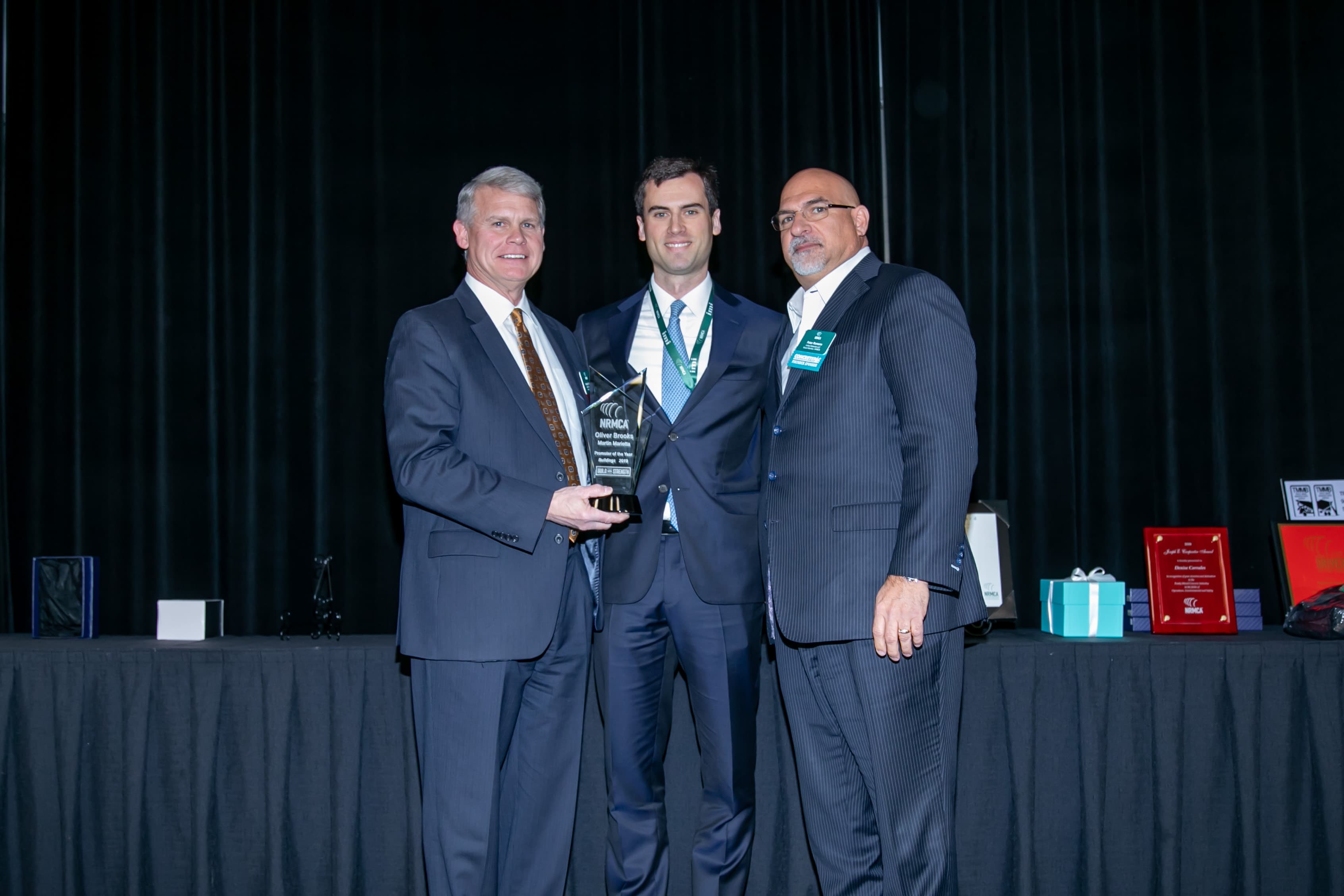From left: Rodney Grogan, chairman of the NRMCA; Brooks; and Peter Romano, a member of the NRMCA Board of Directors, at an awards ceremony in Tampa, Florida.