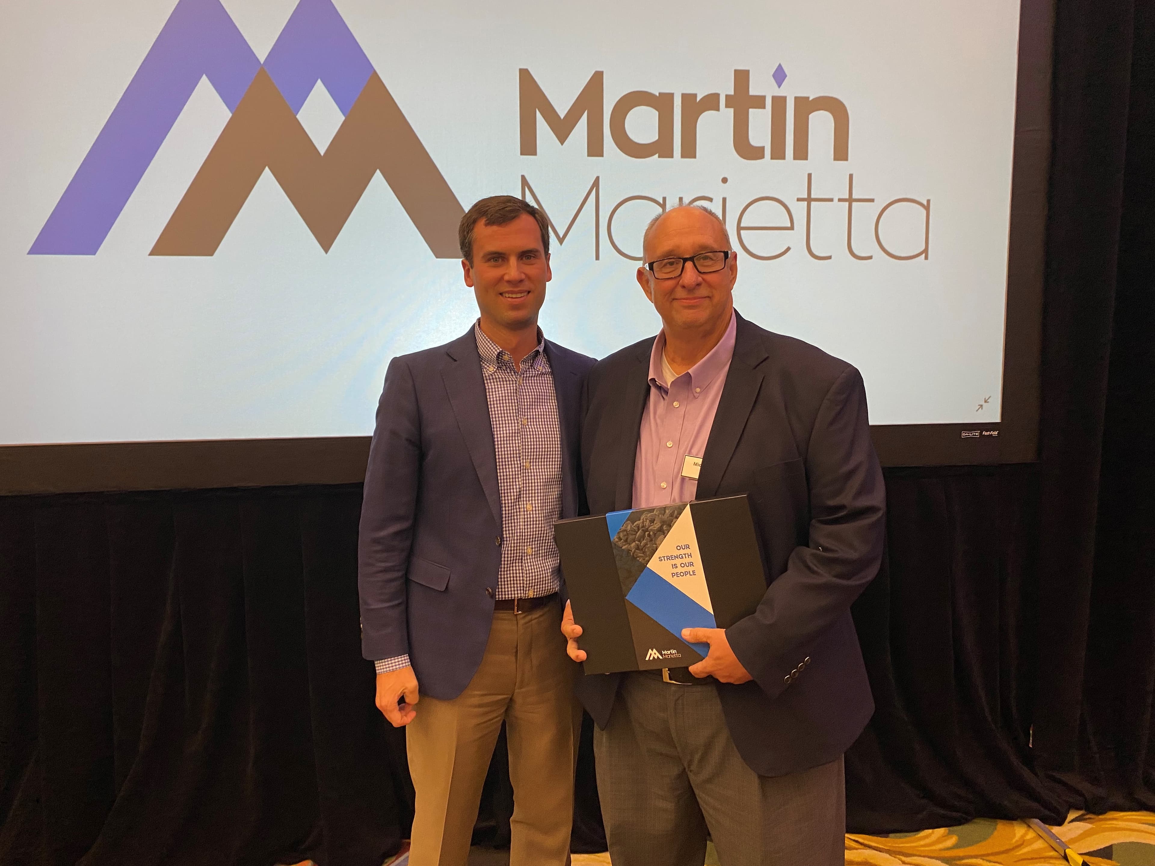 Senior Vice President of Enterprise Excellence Oliver Brooks (left) recognized Michael Hunt’s 35 years of service with Martin Marietta at a recent conference in Dallas.