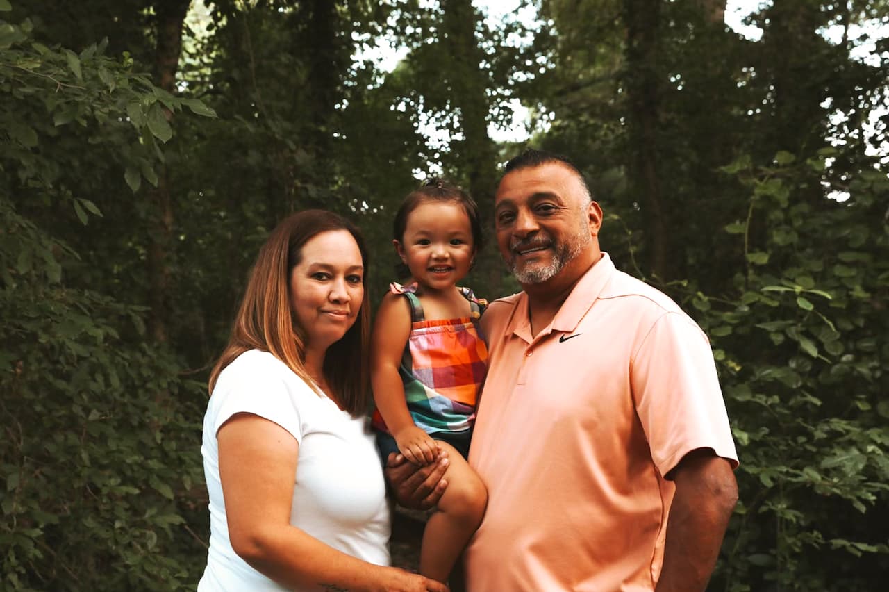 Juan Trevino with his wife, Linda, with their granddaughter, Azaylea