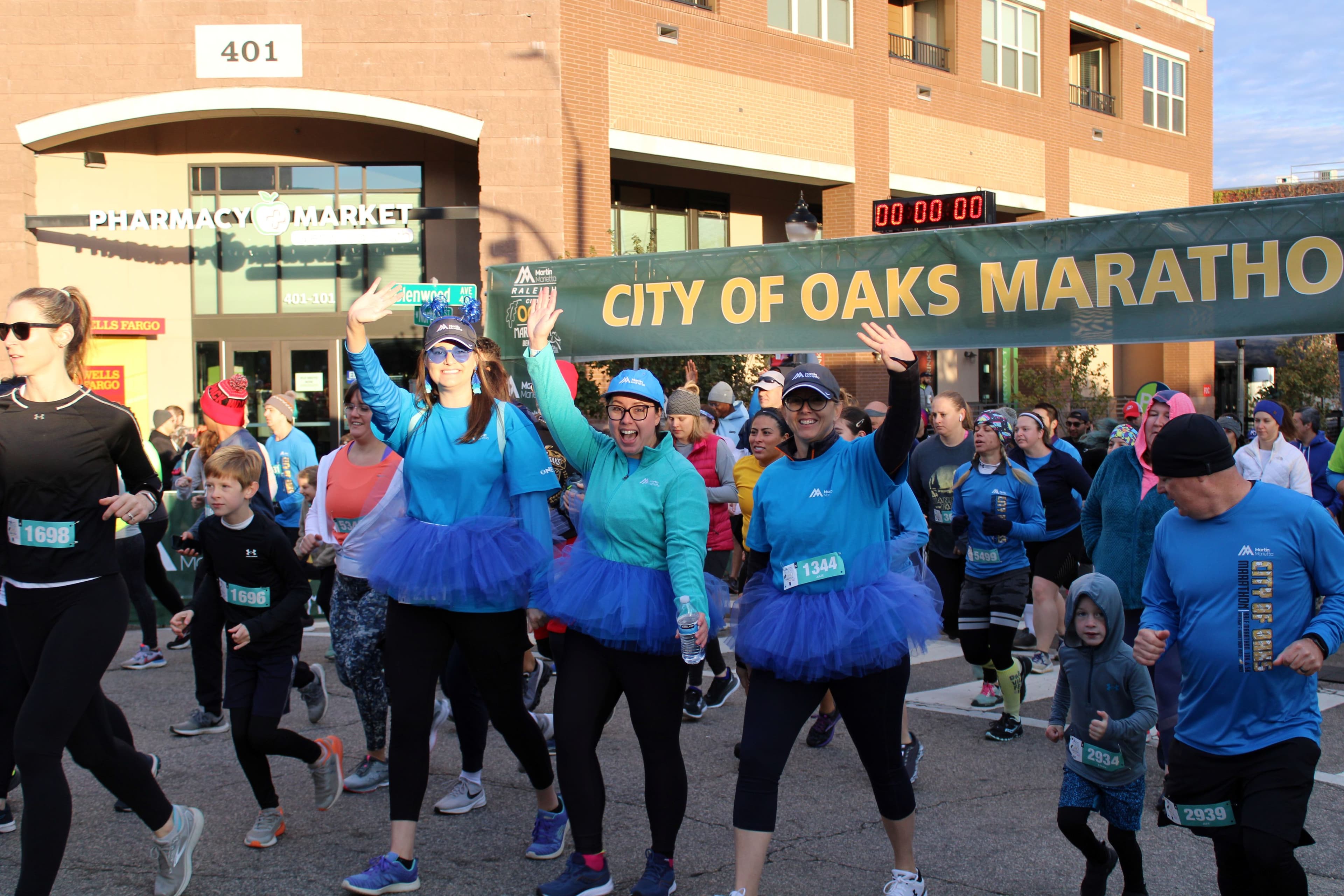 From left to right: Cassi Durham, Jessica Holmes and Julie Barrett, in full Martin Marietta swag walk in the 5K portion of the Martin Marietta City of Oaks Marathon.