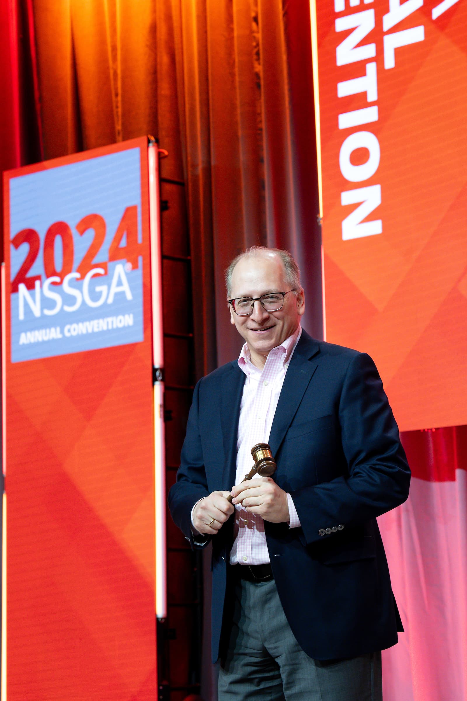 Executive Vice President and Chief Financial Officer Jim Nickolas slams a ceremonial gavel during NSSGA’s Annual Convention. Nickolas is serving as the organization’s 2024 chair.
