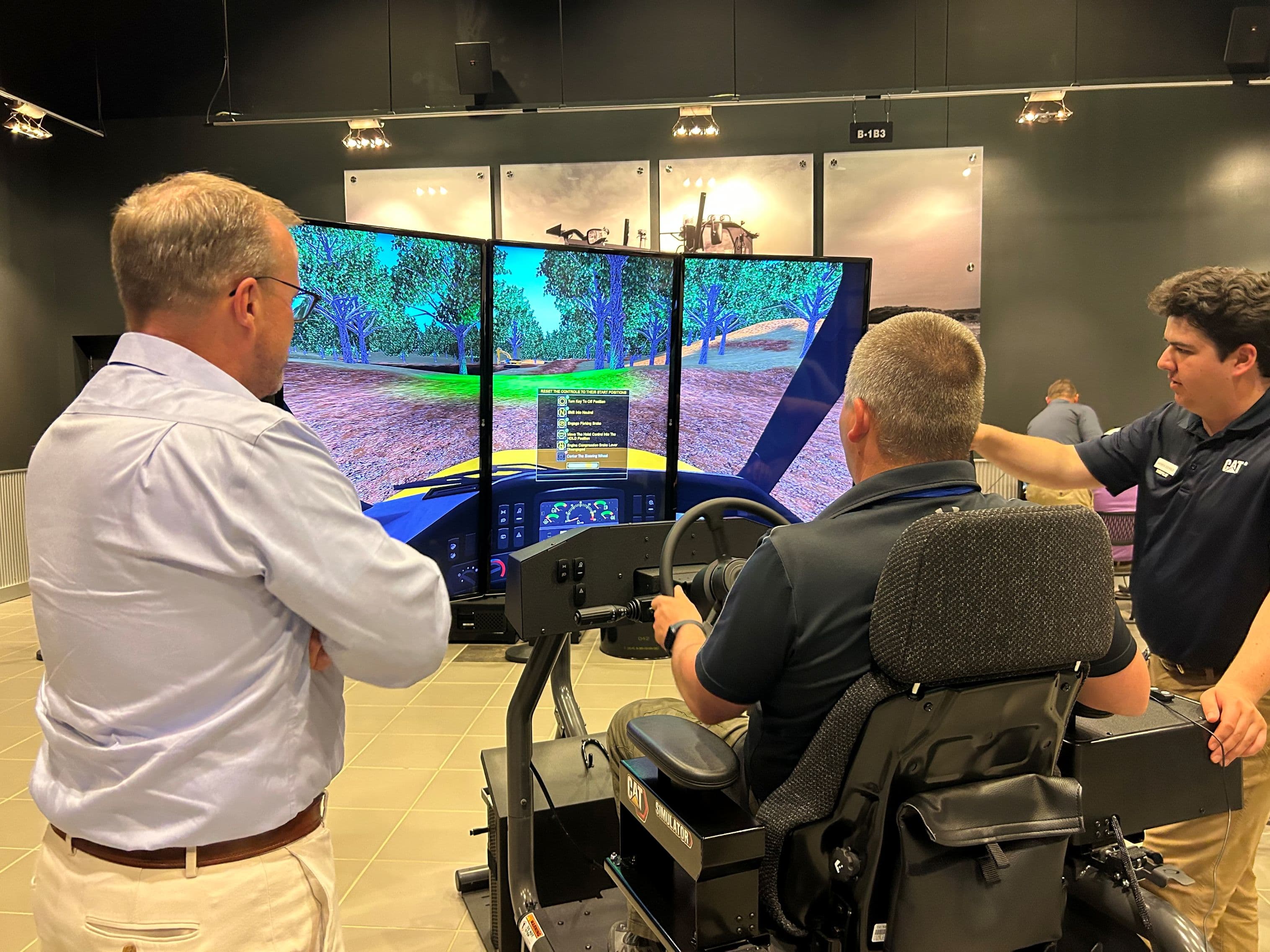 Central Division leaders explore the future of heavy equipment while testing virtual simulators at the Caterpillar Demonstration & Learning Center in Peoria, Illinois.