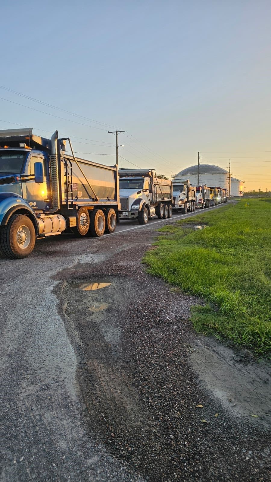 Trucks line up in Tampa to refill with materials to help construction efforts after the storms.