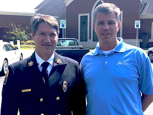 Auburn Fire Department Chief John Lankford (left) stands with Allen Owen.