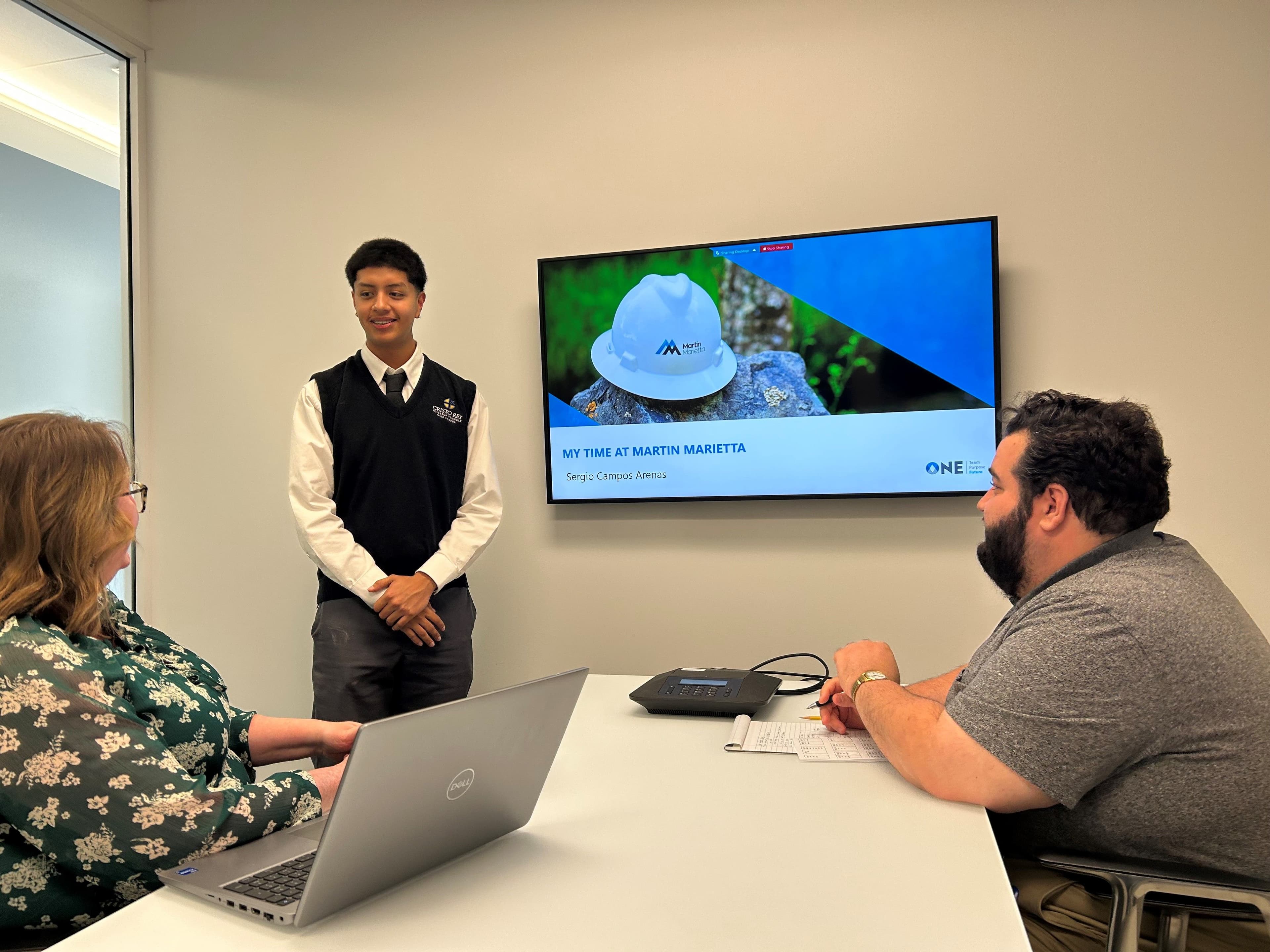 Concluding his two-year internship with Martin Marietta, Sergio Campos Arenas leads a meeting with the Corporate Communications team.